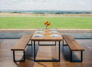 Revitalize your dining room with the Moorland Handmade Industrial Dining Table: Melding rustic sophistication with durable metal legs for a contemporary twist.
