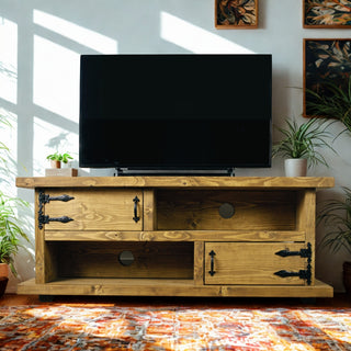 Handmade Bransgore TV unit crafted from solid wood, shown in a rich Dark Oak finish with open shelving and cupboard storage — perfect for a cosy living room setup.