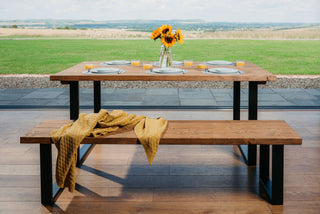 Upgrade your dining space with the Moorland Handcrafted Industrial Dining Table: Merging rustic sophistication with durable metal legs, ideal for contemporary homes.
