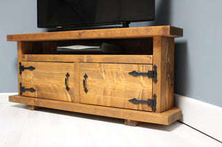Transform your entertainment area with the Hale TV unit, a rustic corner cabinet tailored for big corner TV units.