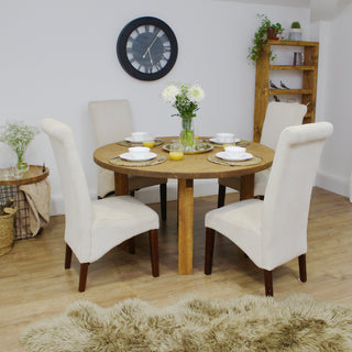 The Bexley round dining table offers modern rustic charm, crafted from solid wood. With its durable construction and handmade craftsmanship, it exudes character and sustainability, embodying the essence of a rustic dining table.