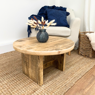 Add eco-friendly charm to your living space with our Handcrafted Reclaimed Low Round Coffee Table: A rustic centerpiece crafted from reclaimed materials.