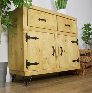 Enrich your living space with the Walhampton Handmade Rustic Solid Wood Sideboard: Offering a blend of rustic charm and practicality, it's perfect for organizing and accentuating your home décor.