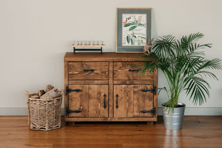 Image consisting of a Rustic sideboard with metal black antique handles and hinges finished in a dark oak wax handmade by Rustic Dreams