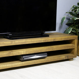 Elevate your entertainment area with the Kingston Solid Wood Rustic TV Unit. Crafted from solid wood, this TV media unit combines rustic charm with functional design, providing ample storage and a stylish focal point for your living space. Handmade in the UK for a touch of uniqueness.