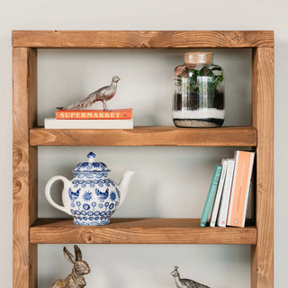 Explore rustic charm with the Highcliffe Solid Wood Rustic Tall Bookcase Shelving Unit. Crafted from solid wood, this tall bookcase offers ample storage and a touch of natural elegance.