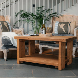 Add rustic charm with Colbury Handmade Coffee Table. Solid wood construction with storage shelf beneath offers functionality and style to any space.