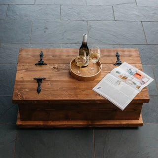 Introducing our Beaulieu chest coffee table, showcasing the rich hues of our dark oak finish that accentuate the natural grain and knots of the rustic wood. Its chest design offers practicality, aiding in keeping your living room tidy and organized.