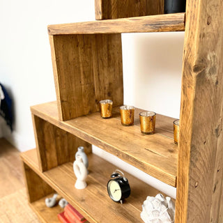 Discover the Ashurst Reclaimed Bookcase, a versatile shelving unit perfect for under stair storage. Crafted from reclaimed solid wood, this modern bookcase offers open compartments for organizing items.