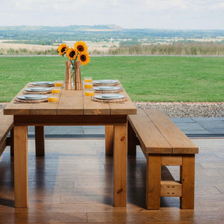 Enhance your dining space with the Rustic Wooden Dining Bench: Handcrafted in Hampshire from solid, chunk wood, it's the perfect complement to your dining room decor.