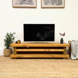 The Ashlett TV unit is a rustic handmade entertainment console unit designed to elevate your living room. Perfect for cottage or farmhouse decor, it adds a touch of handmade, rustic elegance to your home.