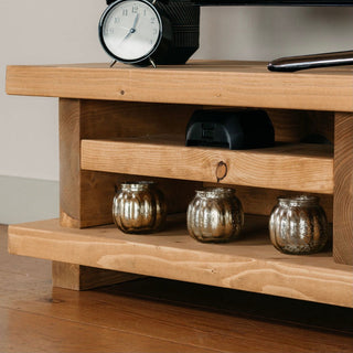 The Canada TV unit brings rustic charm and functionality to your living room. Crafted from solid wood, it features a storage shelf for media devices.