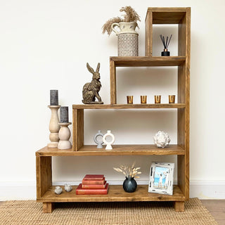 a versatile furniture piece designed for under stair shelves and storage. This modern shelving unit, crafted from reclaimed and solid wood, adds rustic charm to various spaces like the living room, bedroom, hallway, and even the kitchen.
