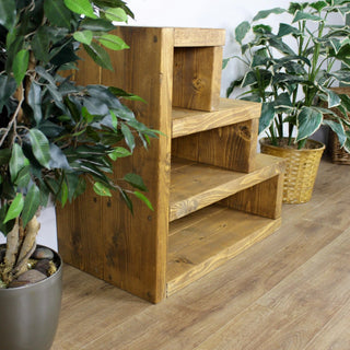 Enhance your living space with the Rustic Sheldon Side Table: Featuring a stepped design and storage shelves, it combines style and functionality.