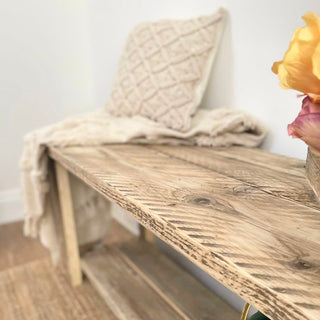 Explore the rustic appeal of our Ryde shoe rack table, constructed from reclaimed and distressed wood for a timeless look. Crafted from solid, recycled wood, this versatile piece serves as both an end table and a shoe storage cabinet.
