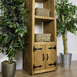 Buckland Tall Rustic Bookcase Display Cabinet with Doors, crafted from solid wood, offers spacious storage and rustic elegance.