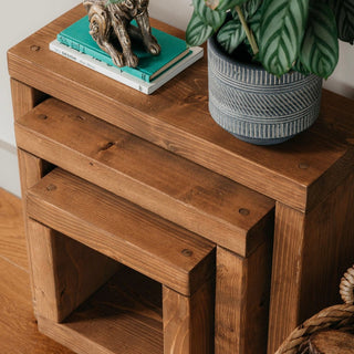 Enhance your living space with the Hythe Handmade Rustic Cube Nest of Side Tables, expertly crafted in the UK from solid wood for timeless appeal.