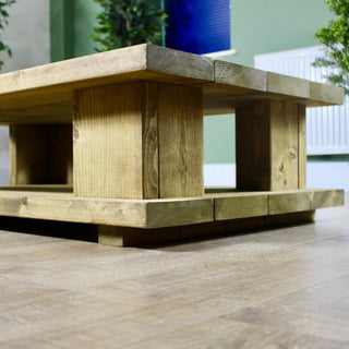 Add rustic charm to your living space with the Lepe Handmade Coffee Table. Handcrafted from solid wood, it boasts a practical drawer for storage.