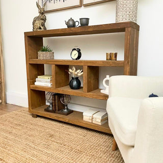 Transform your space with the Landford Rustic Handmade Shelving Bookcase. Crafted from solid wood, this handmade bookcase offers rustic charm and ample storage, making it the perfect addition to any home decor.