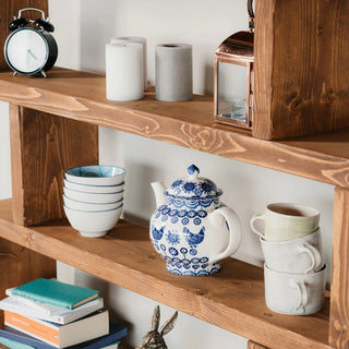 Transform your space with the Rustic Solid Wood Christchurch Bookcase: A tall, farmhouse-inspired shelving unit in natural wood, pictured in dark oak, designed with open shelves for stylish storage.