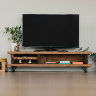 Enhance your home entertainment with the Blissford low TV unit, crafted from solid wood. This TV stand offers a stylish solution for your living room media needs, combining durability and elegance in one.