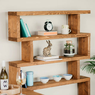 Introduce rustic elegance to your space with the Rustic Solid Wood Christchurch Bookcase: Crafted from natural wood, it's a farmhouse-inspired shelving unit with open shelves for versatile storage.