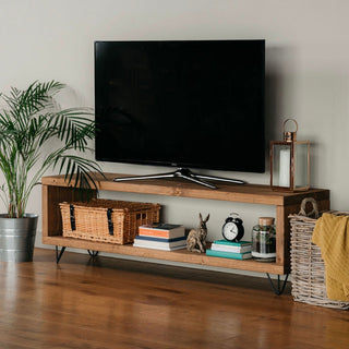 Romsey TV unit, a handmade rustic wooden entertainment unit designed to add both style and functionality to your home. Crafted from solid wood, this bespoke console unit features a large shelf for storage.