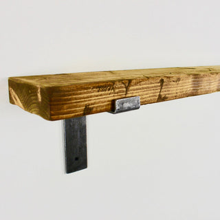 Experience rustic elegance with the handmade Blackshaw shelf featuring solid wood and industrial brackets for a touch of vintage charm.