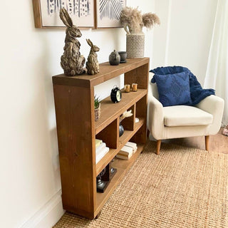 Introduce rustic charm to your space with the Landford Rustic Handmade Shelving Bookcase. Crafted from solid wood, this handmade bookcase offers ample storage and adds character to any room.
