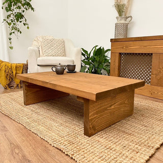 Introduce rustic elegance with the Burley Small Solid Wood Rustic Low Coffee Table, crafted from solid wood for timeless charm in your living space.