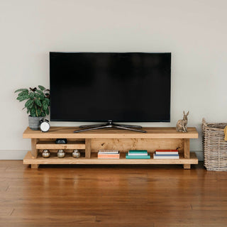 Explore the Canada TV unit, a rustic wooden entertainment piece for your living room. Crafted from solid wood, it offers ample storage shelves.