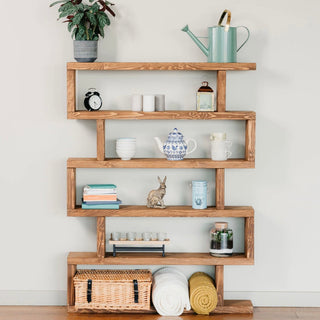 Elevate your farmhouse-inspired decor with the Rustic Solid Wood Christchurch Bookcase: A tall shelving unit in natural wood, pictured in dark oak, blending Scandinavian charm with ample storage.