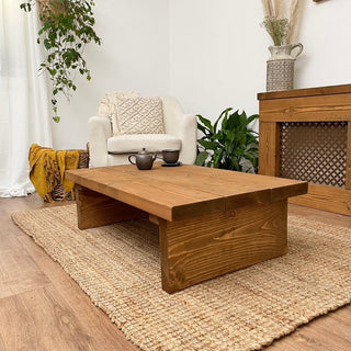 Explore the Burley Small Solid Wood Rustic Low Coffee Table, a charming addition to any living space with its rustic design and solid wood construction.