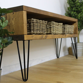 Transform your hallway with the Holmestead industrial console table, featuring rustic charm and industrial flair for a stylish entryway statement piece.