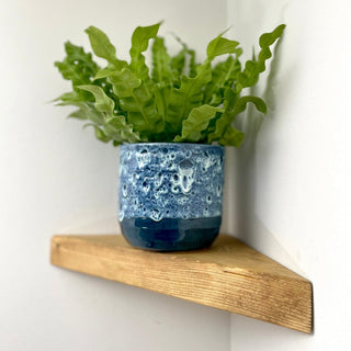 Add charm to any corner with Hatfield Solid Wood Rustic Floating Shelves. Handcrafted from solid wood, these shelves elevate your space with rustic allure.