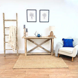 Discover rustic elegance with the Winford Solid Wood Reclaimed Console Table with Storage, a custom-crafted masterpiece that seamlessly blends reclaimed wood's natural beauty with practical storage solutions.