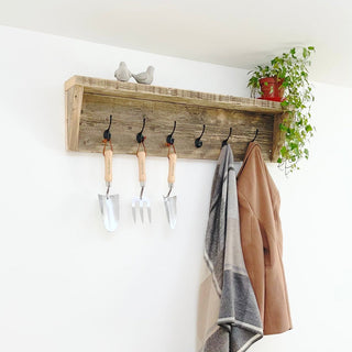 Add charm to your entryway with a reclaimed coat hook, a solid wood piece crafted with character and sustainability in mind for rustic, functional decor.