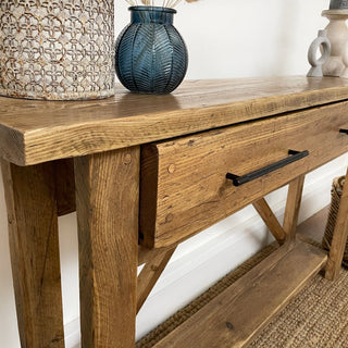 The Barton Console Unit, meticulously handcrafted in the UK, arrives fully assembled. Its rustic design, crafted from chunky solid wood, adds a touch of modern elegance to any home decor style, from farmhouse to coastal.