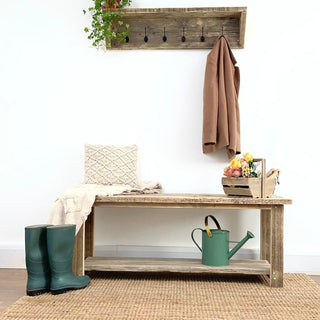 Our Ryde shoe rack table, a versatile piece crafted from reclaimed and recycled wood. Featuring distressed and natural wood finishes, this solid wooden end table doubles as a shoe storage solution with a dedicated shelf. Ideal for cottage or farmhouse decor.