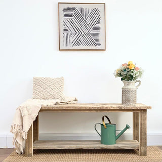 Introducing the Ryde shoe rack table, crafted from reclaimed and distressed wood for a rustic appeal. Made from solid, recycled wood, this versatile piece serves as both an end table and shoe storage solution.