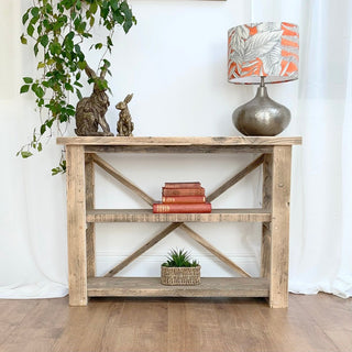 Explore the versatility of our Winford shelving unit, crafted from reclaimed and distressed wood for a rustic yet modern touch. This solid wood bookcase offers ample shelf space for storage, making it an ideal addition to farmhouse or cottage decor.