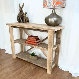 Introduce rustic charm to your living space with the Winford shelving unit, crafted from reclaimed and distressed solid wood. This versatile bookcase features shelves for storage, perfect for displaying books and decor items in your living room, dining room, bedroom, or hallway.