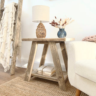 This cottage-inspired, reclaimed side table, crafted from salvaged wood, brings natural warmth to your room decor. Featuring an open shelf design for additional storage, it's versatile as both a side table for living rooms and rustic bedside tables.