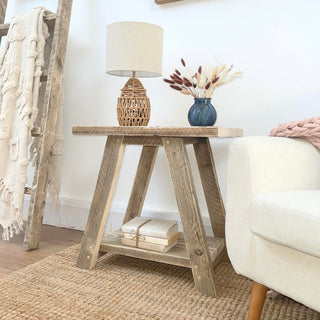 Introduce rustic charm to your living space with the Yarmouth side table, a reclaimed piece crafted from salvaged and distressed wood. This Scandinavian-inspired side table features an open shelf design, perfect for displaying decorative items.