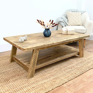 Elevate your living room with the Yarmouth coffee table, a unique and rustic addition handmade in the UK from reclaimed wood. This small, wooden coffee table offers the charm of a farmhouse aesthetic, embodying the natural beauty of reclaimed wood.