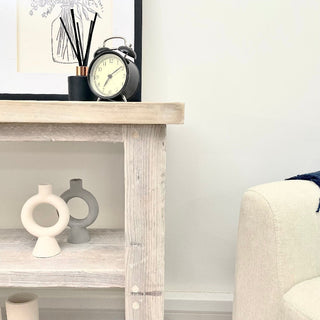 Discover the rustic elegance of our Ryde shoe rack table, handcrafted in Hampshire from reclaimed and distressed wood. Made from solid, recycled wood, this versatile piece functions as both an end table and a shoe storage cabinet, offering ample space for organizing footwear.