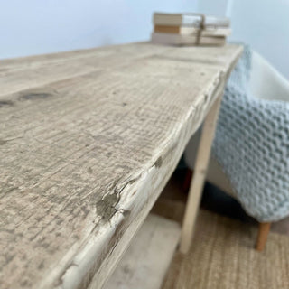 Discover the timeless elegance of the Ryde Console Table, meticulously handcrafted from reclaimed wood, offering both style and functionality with its storage shelf.