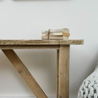 Introducing the Ryde Console Table: A beautifully handcrafted piece made from reclaimed wood, complete with a storage shelf for added functionality.