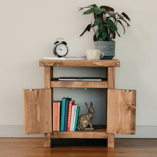 The Alderbury side table is a rustic, handmade wooden accent piece perfect for your living room or bedroom. Crafted from solid wood, this natural side table adds warmth and character to any space.