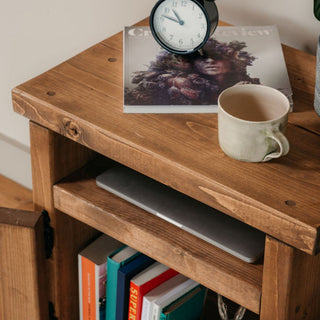 Introducing the Alderbury side table, a rustic wooden accent perfect for your living room or bedroom. This handmade side table adds natural elegance with its solid wood construction